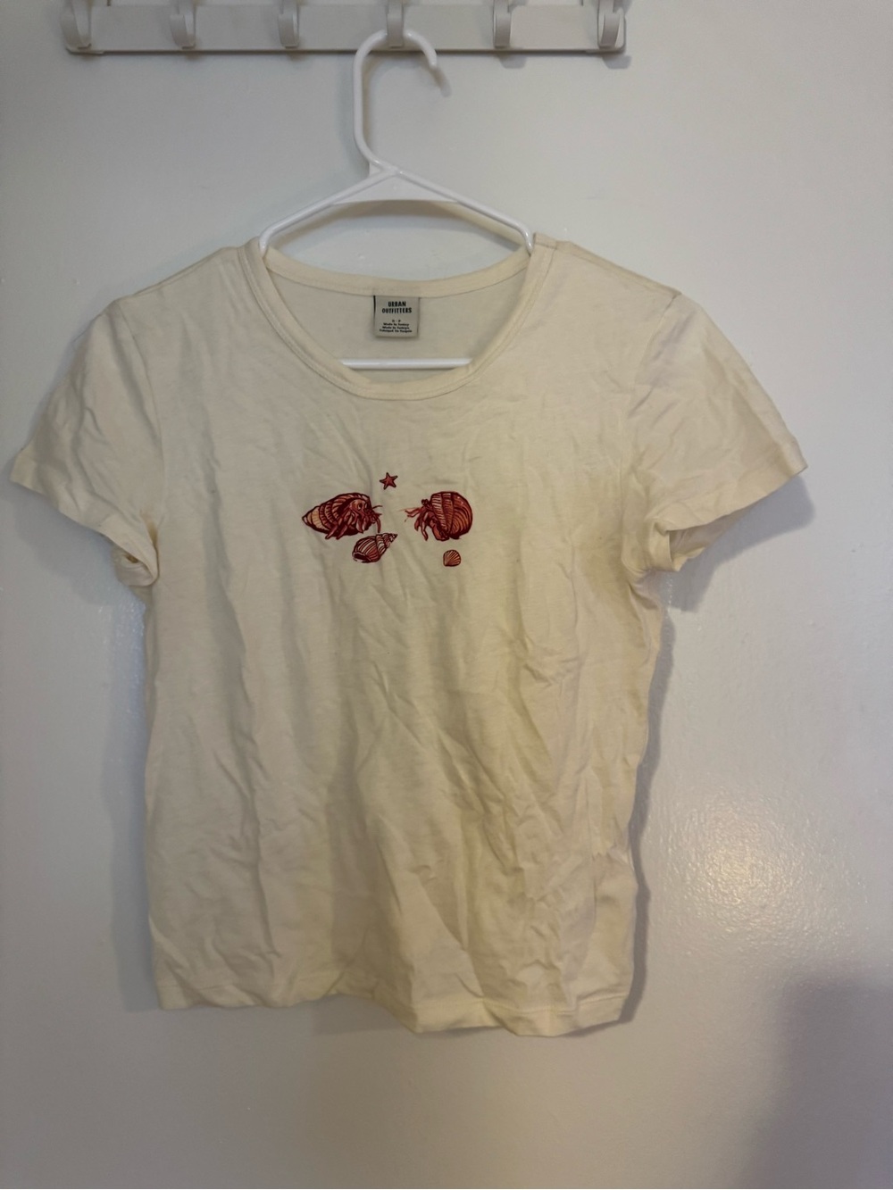 UO Cream Short Sleeve Tee with Red Shell Graphic